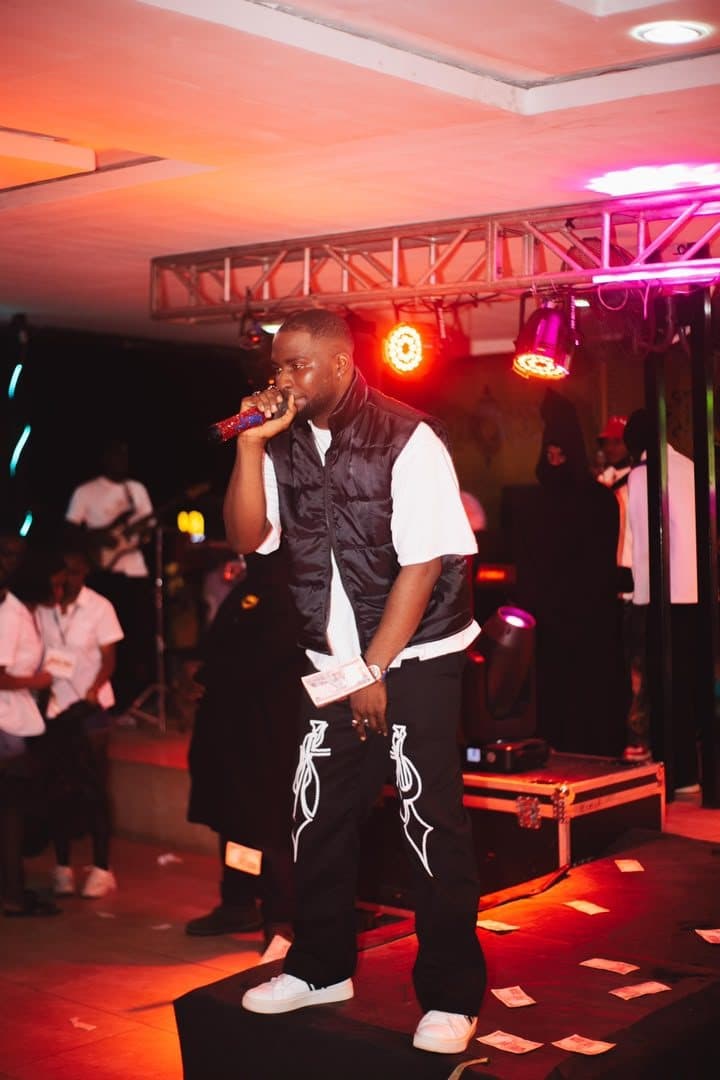 Woriidem performing under red and pink lights